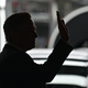 A photo of Elon Musk waving at Tesla's German Gigafactory.